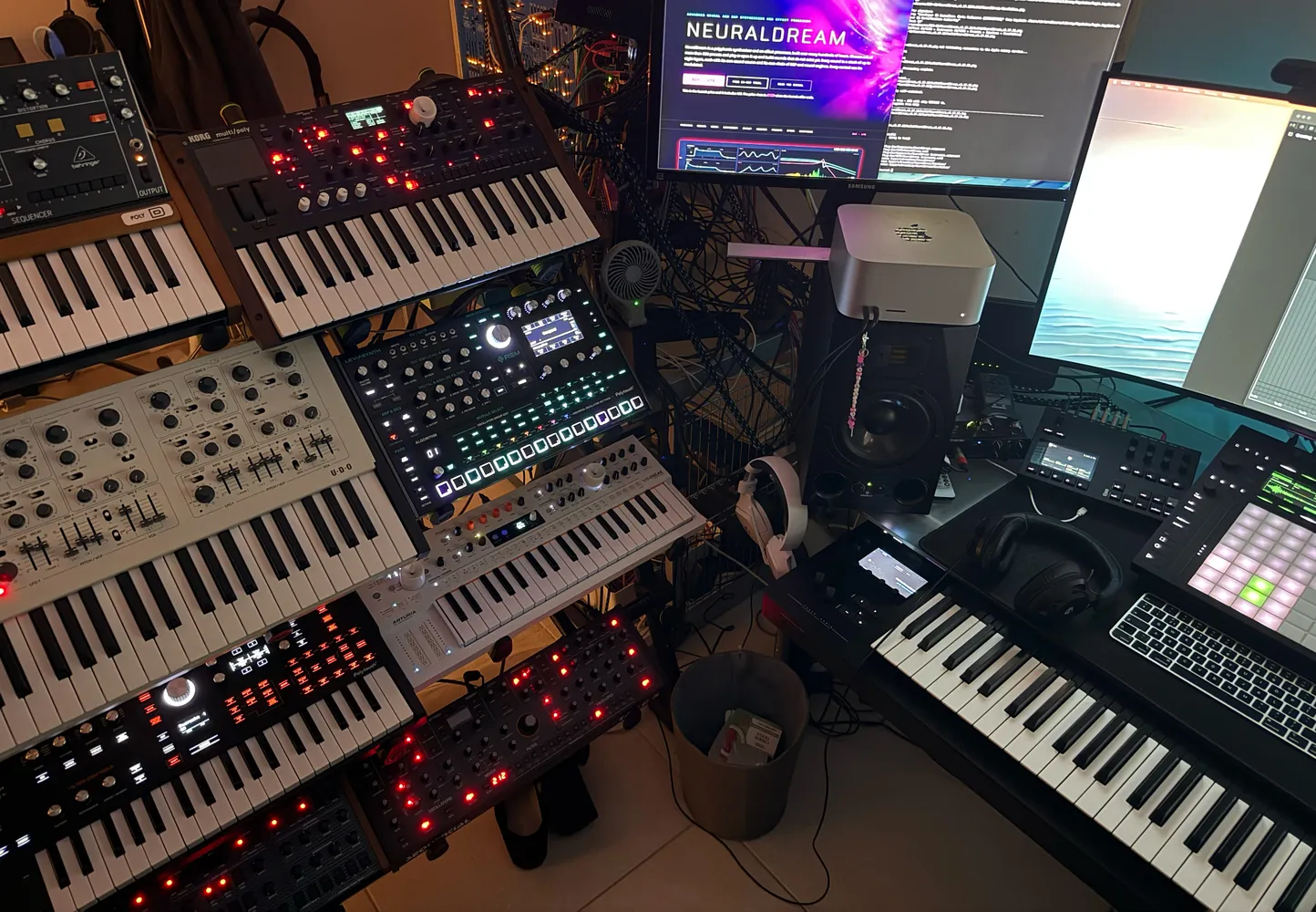 The studio from above, with keyboards on the left and NeuralDream on the computer screens.